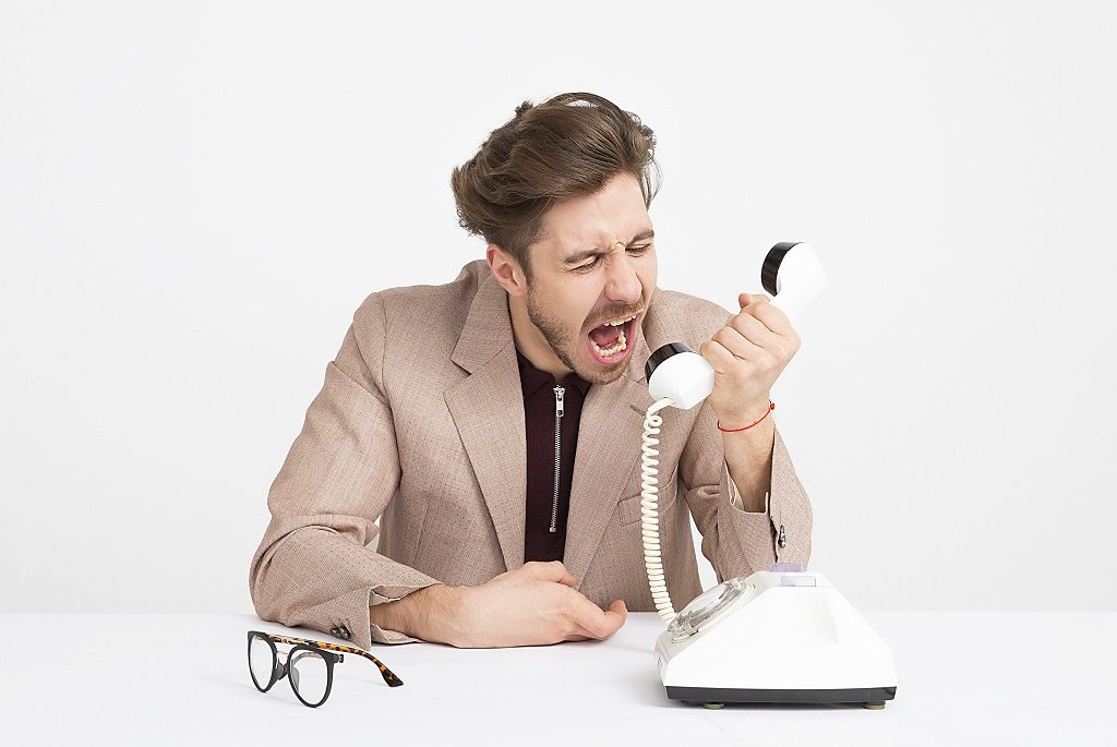 Usable leadership - man screaming into phone.